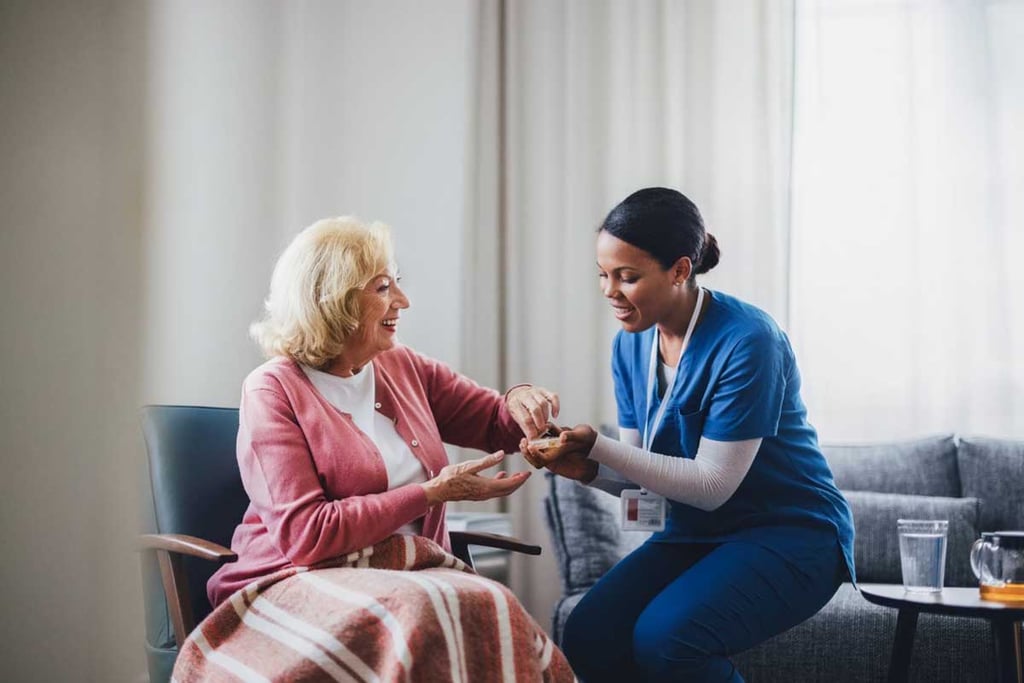 Healthcare Worker Assisting Elderly Woman in Comfortable Home Environment