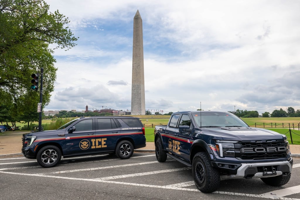Marked ICE vehicles near the Washington Monument