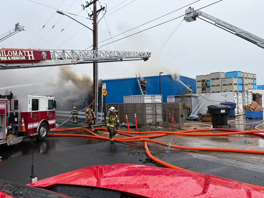 Firefighters battle the Pacific Seafood fire in Newport