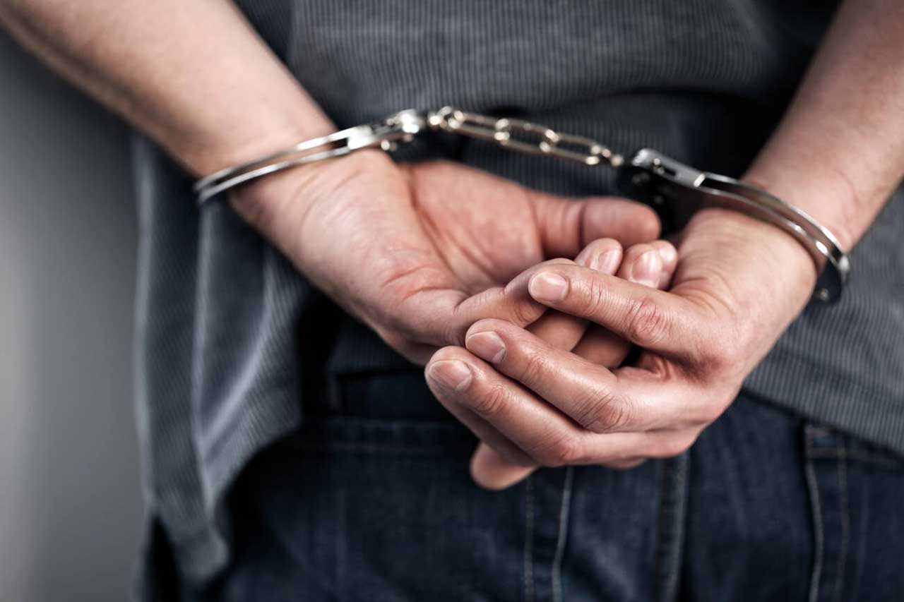 Criminal in hadcuffs - Police arrest - Oregon